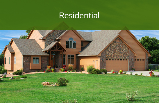 A home with a pristine lawn. Click to learn more about residential services.